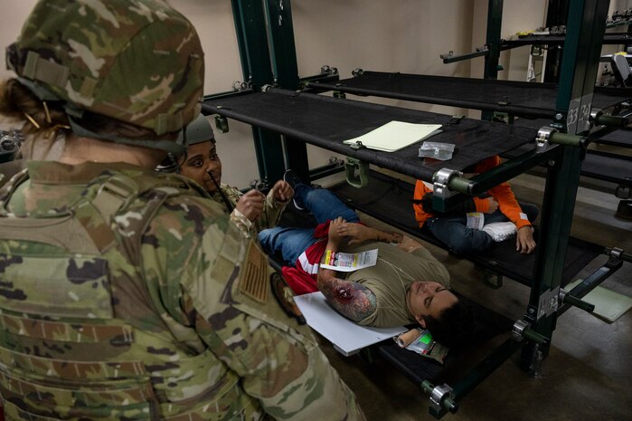 U.S. Air Force medical personnel assigned to the 35th Medical Group simulate taking an x-ray of a casualty actor during the Beverly Sunrise 24-6 exercise at Misawa Air Base, Japan, Oct. 24, 2024.