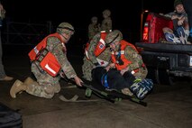 U.S. Air Force and U.S. Navy Medics from the 35th Medical Group simulate medical care procedures to casualty actors during the Beverly Sunrise 24-6 exercise at Misawa Air Base, Japan, Oct. 24, 2024.