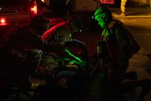 U.S. Air Force and U.S. Navy Medics from the 35th Medical Group simulate medical care procedures to casualty actors during the Beverly Sunrise 24-6 exercise at Misawa Air Base, Japan, Oct. 24, 2024.