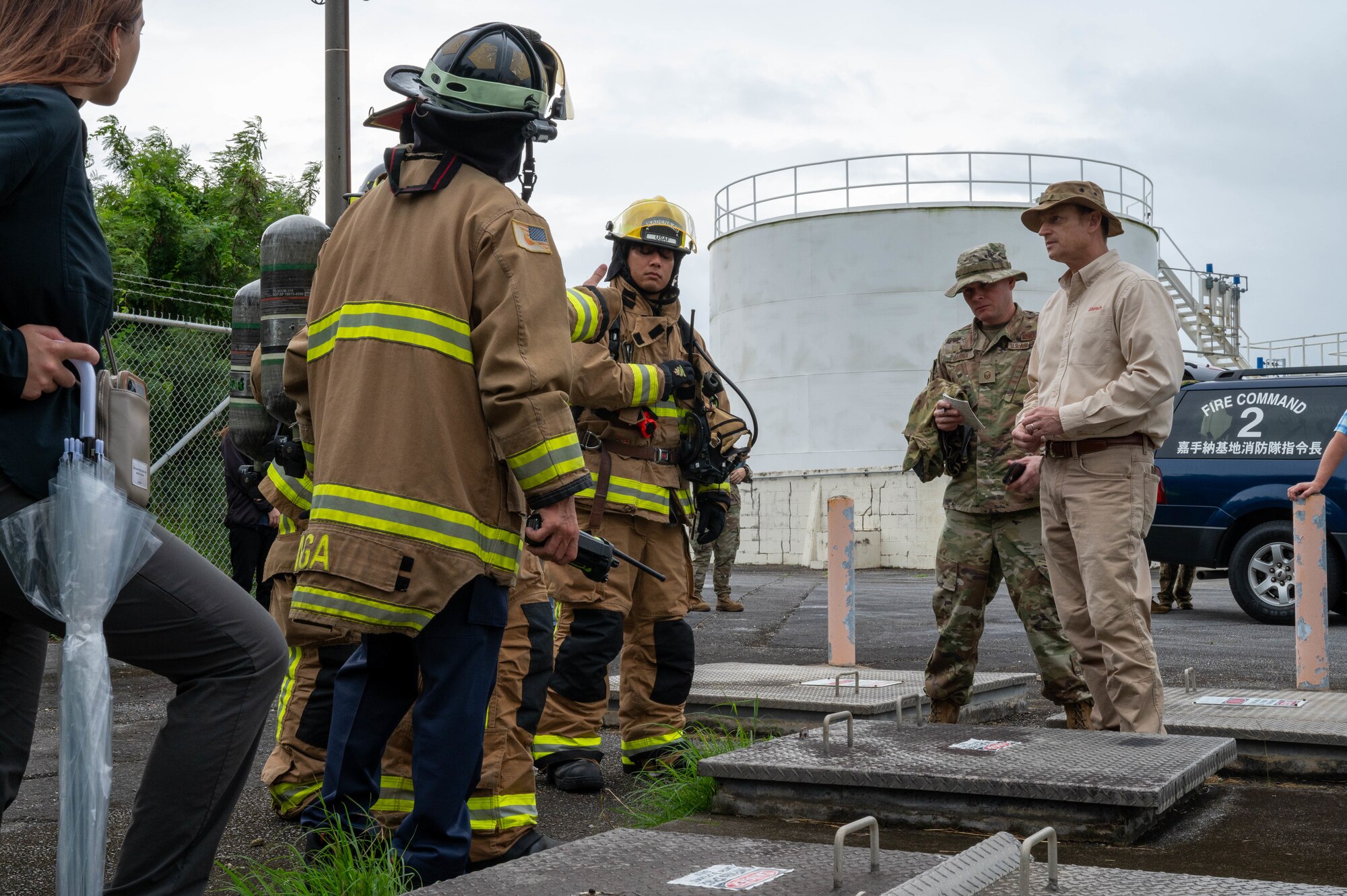 Airmen utilize a containment vault during a spill response training scenario.