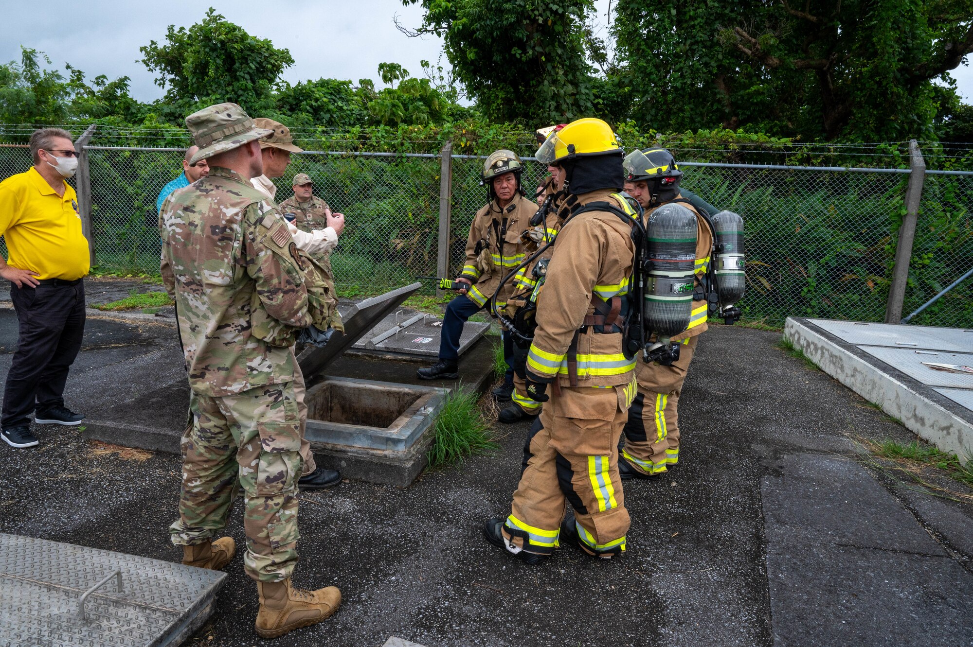 Airmen utilize a secondary containment vault during a spill response training scenario.