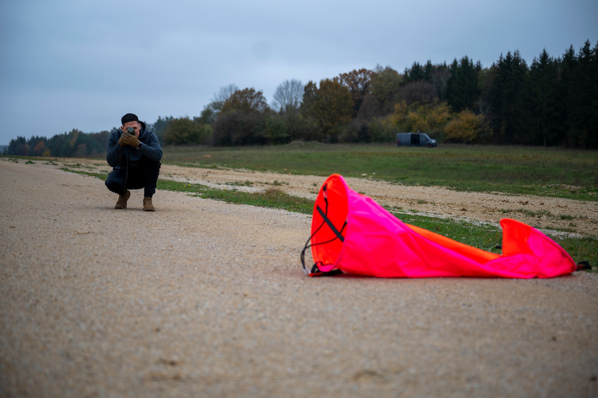 U.S. Air Force Tech. Sgt. Julio Espinet Flecha, 1st Combat Communications Squadron international terminal instrument procedures specialist, verifies landing zone dimensions at Hohenfels Joint Multinational Readiness Center, Germany, Oct. 27, 2024.