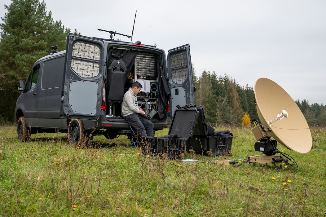 U.S. Air Force Senior Airman Lance Smith, 1st Combat Communications Squadron tactical communications technician, configures a PANTHER 2, Very Small Aperture Terminal satellite on the Mobile Digital Infrastructure vehicle at Hohenfels Joint Multinational Readiness Center, Germany, Oct. 27, 2024.