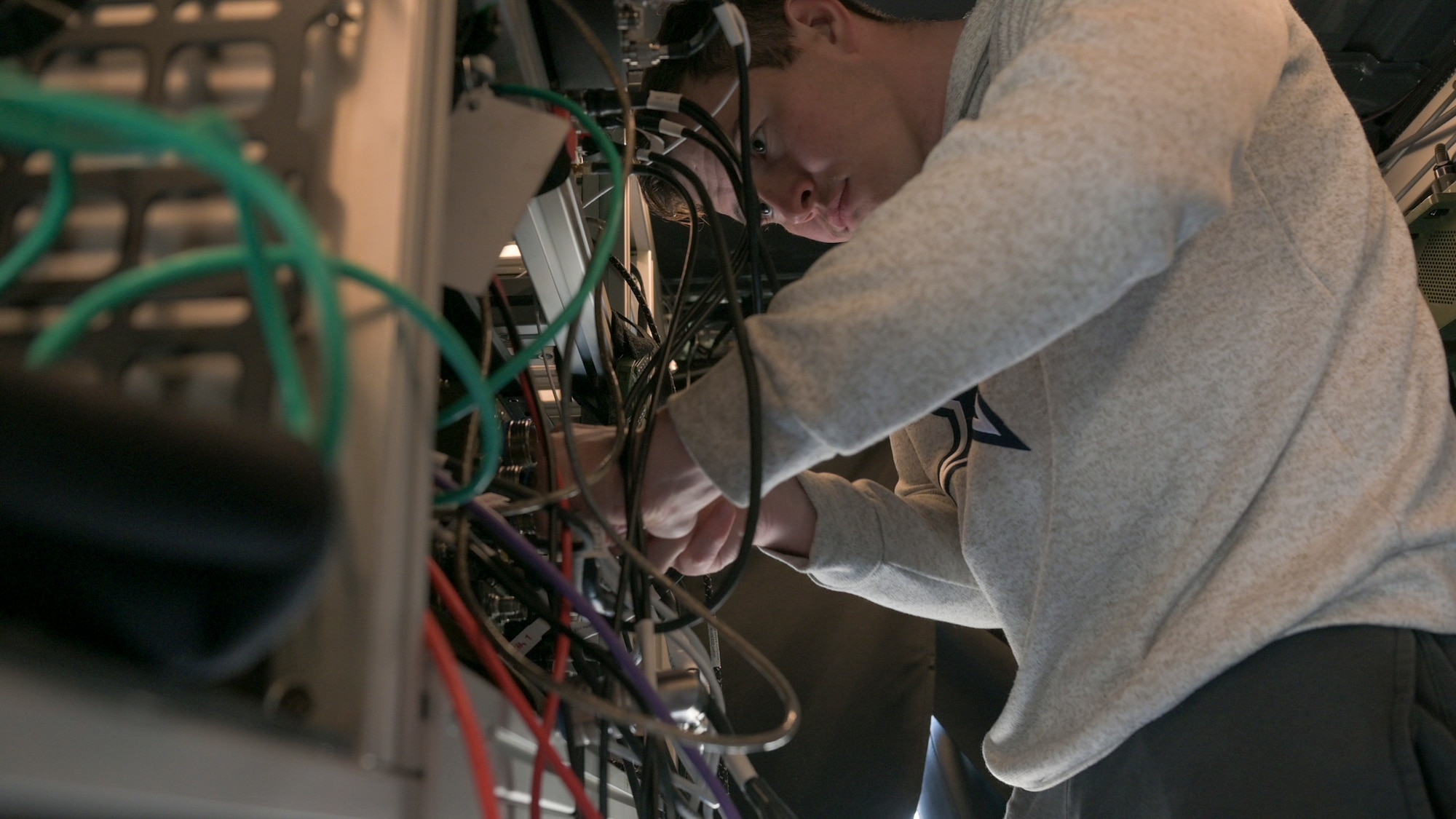 U.S. Air Force Senior Airman Lance Smith, 1st Combat Communications Squadron tactical communications technician, installs a radio on the Mobile Digital Infrastructure (MDI) vehicle at Hohenfels Joint Multinational Readiness Center, Germany, Oct. 28, 2024.