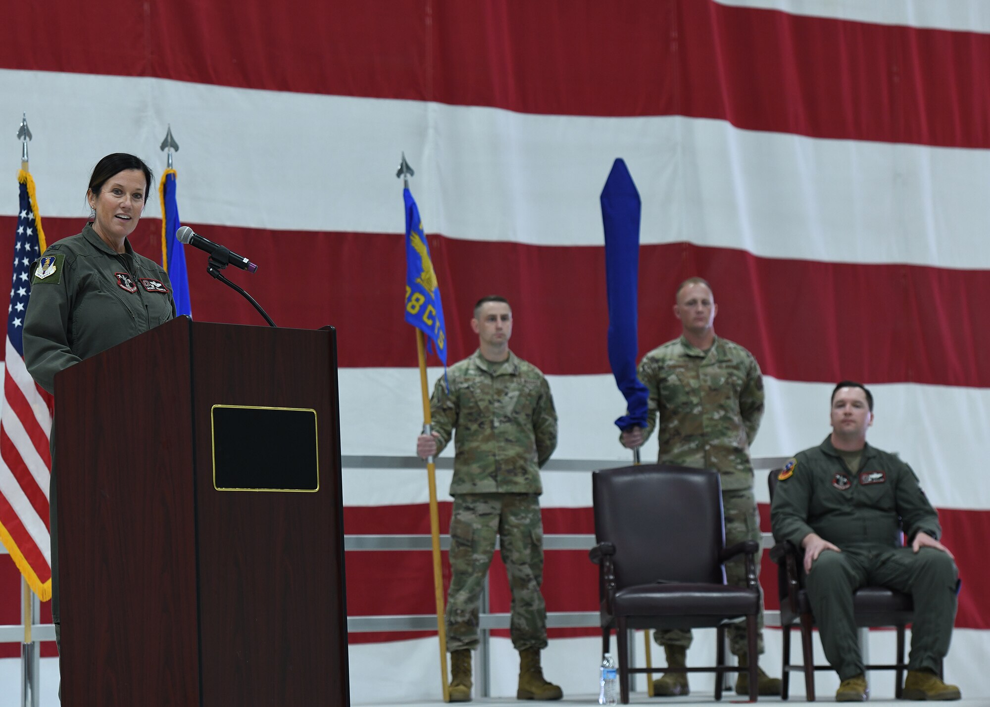 Airmen gives opening speech in an aircraft hangar