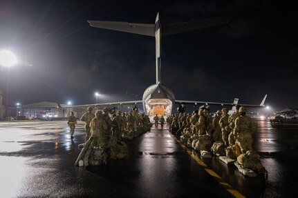 U.S. Army Soldiers from the 2nd Infantry Brigade, 11th Airborne Division load onto a U.S. Air Force C-17 Globemaster III during the Joint Pacific Multinational Readiness Center (JPMRC) exercise at Joint Base Pearl Harbor-Hickam, Hawaii Oct. 14, 2024.
