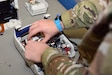 Sgt. Jason Paglia, a biomedical equipment specialist, wears an anti-static wristband while working on a piece of medical equipment at the U.S. Army Medical Materiel Agency's Medical Maintenance Operations Division at Hill Air Force Base, Utah. USAMMA, which is committed to a high standard of workplace safety, is currently working toward certification by the Army Safety and Occupational Health Management System, or ASOHMS.