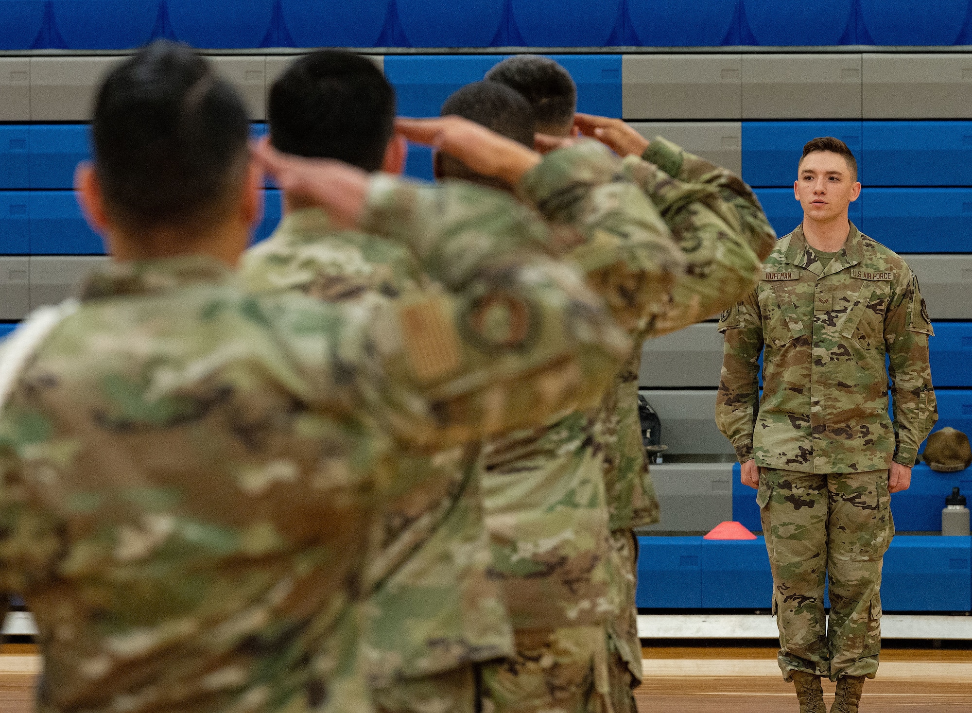 U.S. Air Force Senior Airman Sckylar Huffman, right, Dover Base Honor Guard lead trainer, gives former BHG members the command of Present Arms during a two-day try-out at Dover Air Force Base, Delaware, Sept. 5, 2024. Seventeen former BHG members went through a tryout process for ceremonial guardsman positions needed for the upcoming presidential inauguration ceremony scheduled in January 2025. (U.S. Air Force photo by Roland Balik)