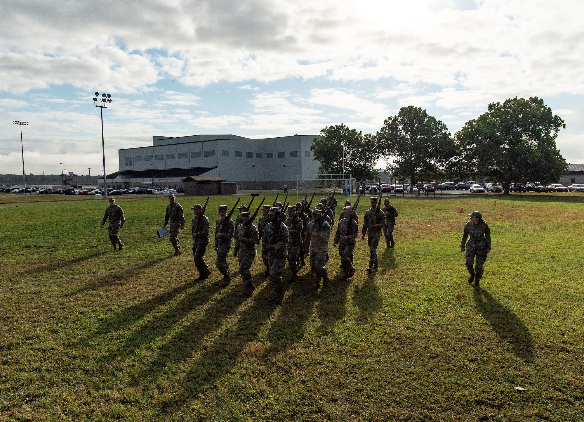 Dover Base Honor Guard cadre watch former BHG members practice marching in formation at the base track on Dover Air Force Base, Delaware, Sept. 6, 2024. Seventeen former BHG members went through a tryout process for ceremonial guardsman positions needed for the upcoming presidential inauguration ceremony scheduled in January 2025. (U.S. Air Force photo by Roland Balik)