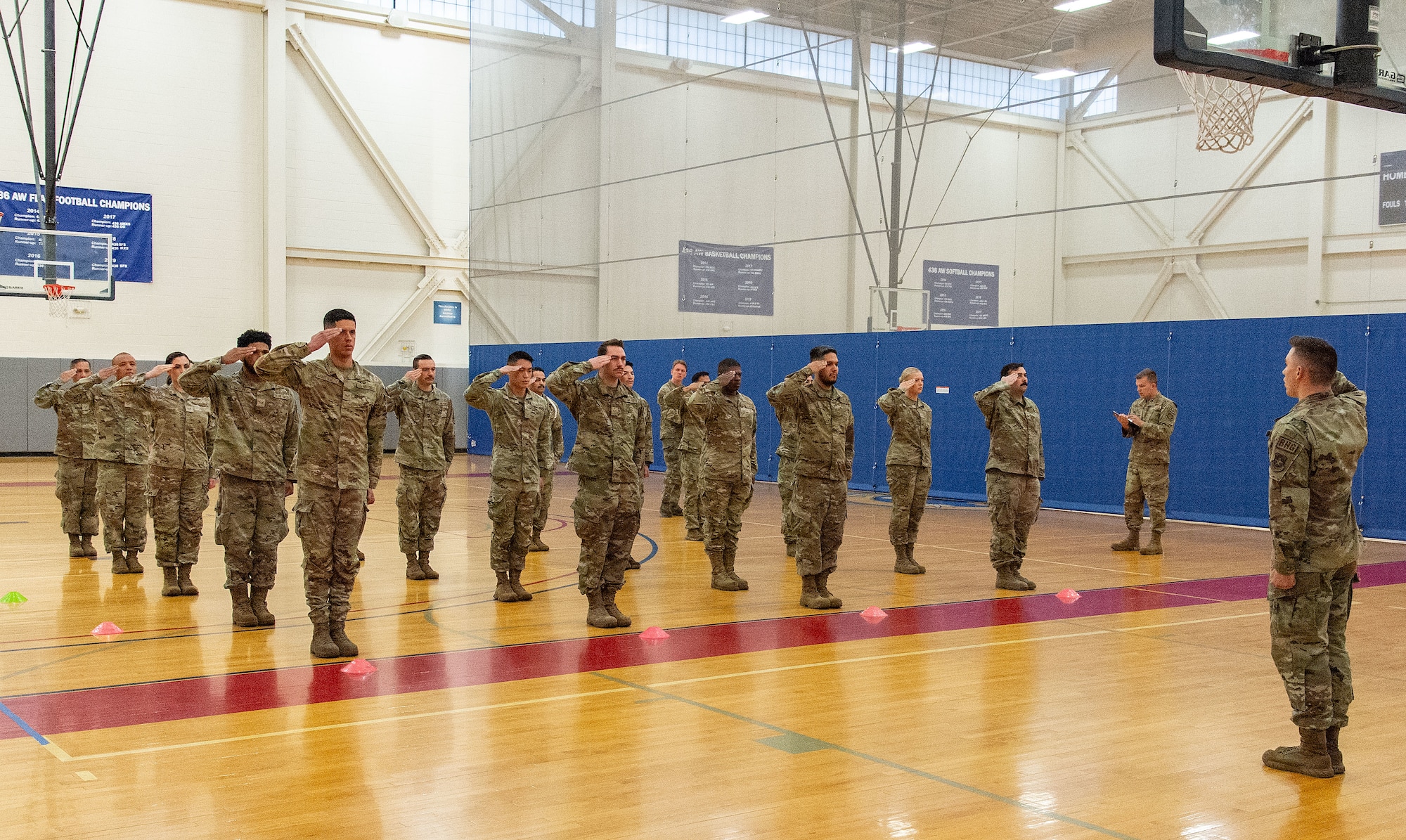 U.S. Air Force Senior Airman Sckylar Huffman, right, Dover Base Honor Guard lead trainer, gives former BHG members the command of Present Arms during a two-day try-out at Dover Air Force Base, Delaware, Sept. 5, 2024. Seventeen former BHG members went through a tryout process for ceremonial guardsman positions needed for the upcoming presidential inauguration ceremony scheduled in January 2025. (U.S. Air Force photo by Roland Balik)