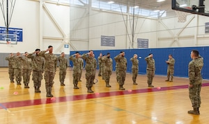 U.S. Air Force Senior Airman Sckylar Huffman, right, Dover Base Honor Guard lead trainer, gives former BHG members the command of Present Arms during a two-day try-out at Dover Air Force Base, Delaware, Sept. 5, 2024. Seventeen former BHG members went through a tryout process for ceremonial guardsman positions needed for the upcoming presidential inauguration ceremony scheduled in January 2025. (U.S. Air Force photo by Roland Balik)