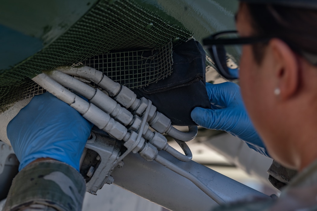 A U.S. Air Force Airman assigned to the 23rd Security Forces Squadron hides simulated contraband in a plane at Moody Air Force Base, Georgia, Oct. 28, 2024. The material was used for a K-9 demonstration as part of Battlefield Circulation immersion for 23rd Wing leadership.  (U.S. Air Force photo by Airman 1st Class Iain Stanley)