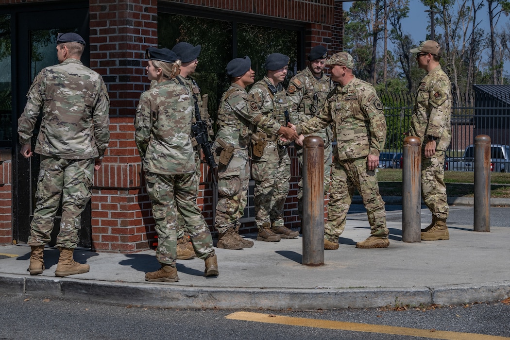 U.S. Air Force Col. Gary Symon, 23rd Wing acting commander, and Chief Master Sgt. William Nabakowski, 23rd Wing acting command chief, greet Airmen assigned to the 23rd Security Forces Squadron at Moody Air Force Base, Georgia, Oct. 28, 2024. The 23rd SFS hosted Symon and Nabakowski for an annual immersion, referred to as a Battlefield Circulation. (U.S. Air Force photo by Airman 1st Class Savannah Carpenter)