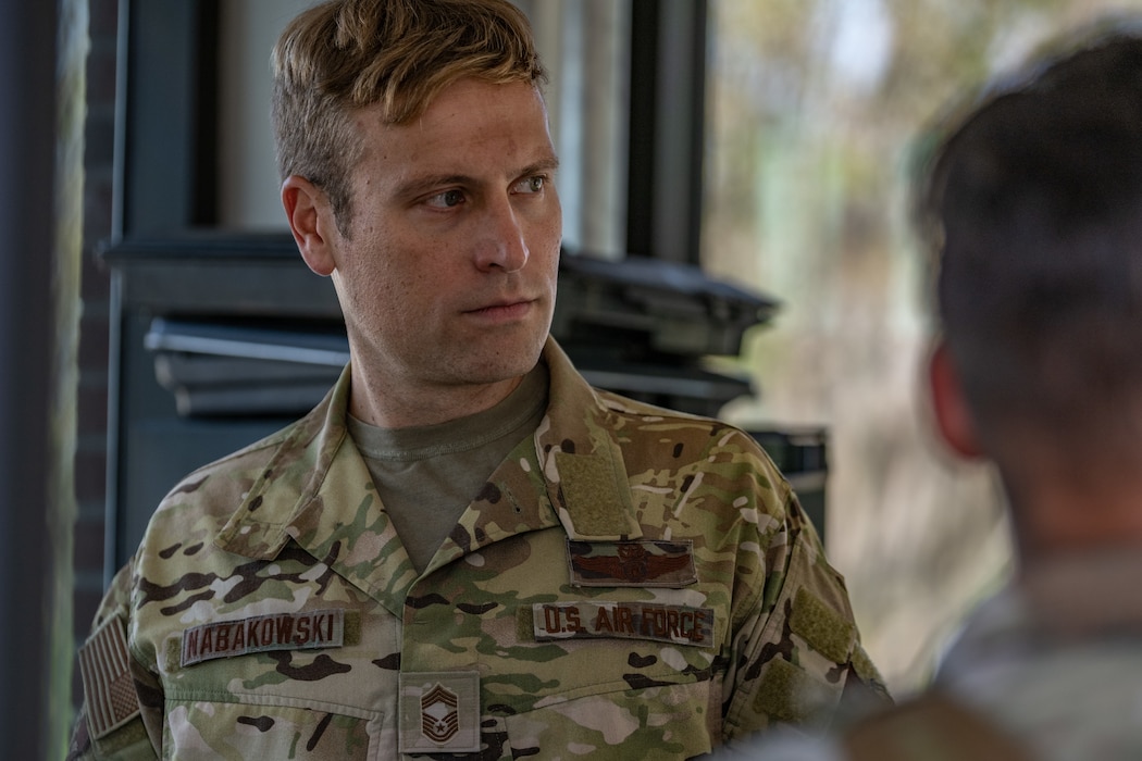 U.S. Air Force Chief Master Sgt. William Nabakowski, 23rd Wing acting command chief, receives a brief on gate procedures at Moody Air Force Base, Georgia, Oct. 28, 2024. The Battlefield Circulation, or immersion, informed leadership on the 23rd Security Forces Squadron’s varying mission sets and provided them an opportunity to connect with Airmen. (U.S. Air Force photo by Airman 1st Class Savannah Carpenter)