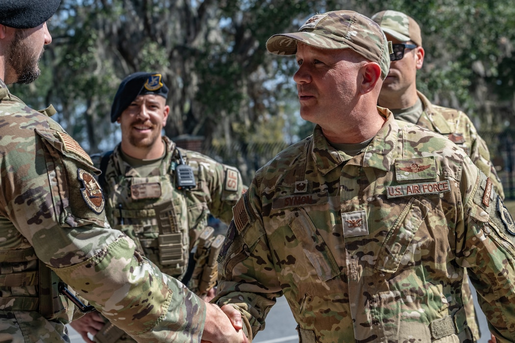 U.S. Air Force Col. Gary Symon, 23rd Wing acting commander, greets Airmen assigned to the 23rd Security Forces Squadron at Moody Air Force Base, Georgia, Oct. 28, 2024. The Battlefield Circulation, or immersion, included a tour of the 23d SFS facilities and a military working dog demonstration. (U.S. Air Force photo by Airman 1st Class Savannah Carpenter)