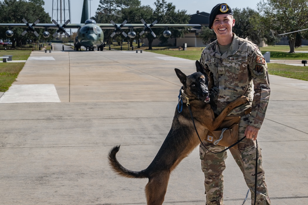 U.S. Air Force Staff Sgt. April Ray, 23rd Security Forces Squadron military working dog handler, poses for a photo at Moody Air Force Base, Georgia, Oct. 28, 2024. The military working dog team demonstrated de-escalation tactics and substance detection as part of a Battlefield Circulation immersion for 23rd Wing leadership. (U.S. Air Force photo by Airman 1st Class Savannah Carpenter)