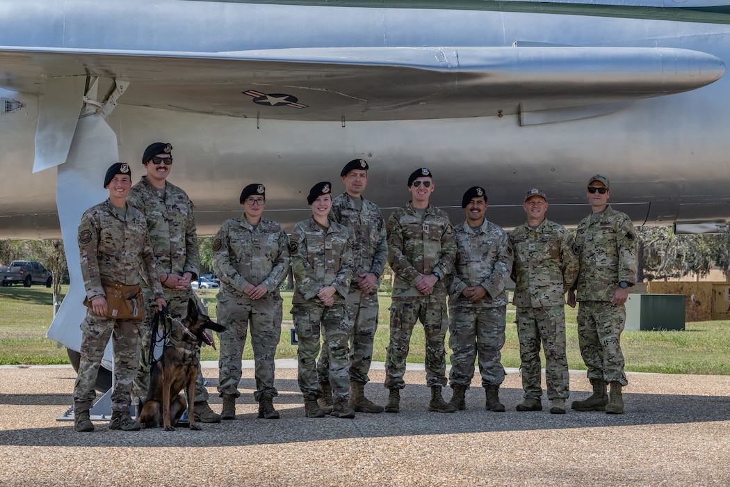 U.S. Air Force Col. Gary Symon, 23rd Wing acting commander, second from right, and Chief Master Sgt. William Nabakowski, 23rd Wing acting command chief, far right, pose for a photo with Airmen assigned to the 23rd Security Forces Squadron at Moody Air Force Base, Georgia, Oct. 28, 2024. Leadership conducted a Battlefield Circulation, or immersion, to connect with Airmen and gain a better understanding of their mission. (U.S. Air Force photo by Airman 1st Class Savannah Carpenter)