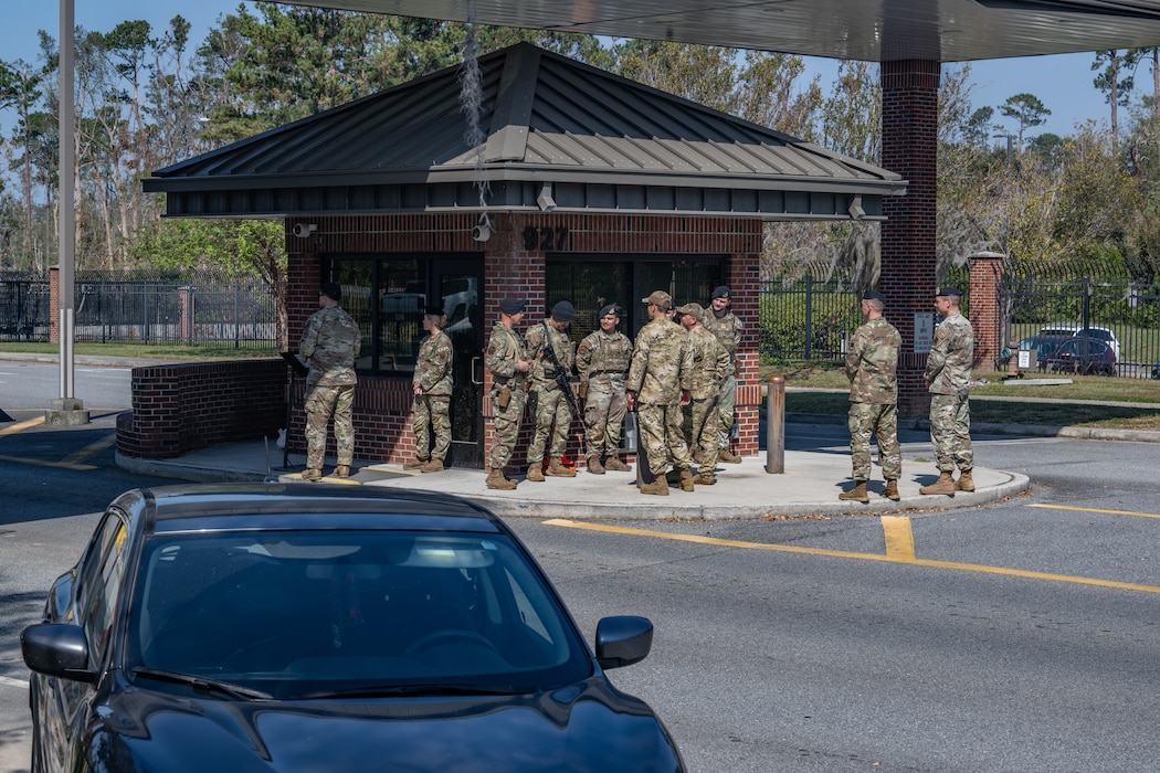 U.S. Air Force Col. Gary Symon, 23rd Wing acting commander, and Chief Master Sgt. William Nabakowski, 23rd Wing acting command chief, greet Airmen assigned to the 23rd Security Forces Squadron at Moody Air Force Base, Georgia, Oct. 28, 2024. Symon and Nabakowski received a presentation on gate procedures as part of a Battlefield Circulation immersion. (U.S. Air Force photo by Airman 1st Class Iain Stanley)