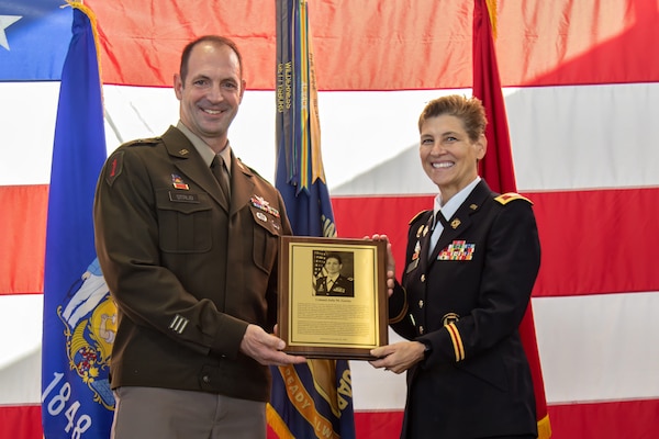 U.S. Army Brig. Gen. Matthew Strub, Wisconsin's deputy adjutant general for Army, recognizes Wisconsin Army National Guard Hall of Honor members with custom lapel pins signifying their significant contribution to the Wisconsin National Guard mission. The Hall of Honor program was established in 2000 to recognize the special contributions National Guard members make to the overall success of the Wisconsin National Guard. (U.S. Army National Guard photo by Staff Sgt. Amanda Stock)