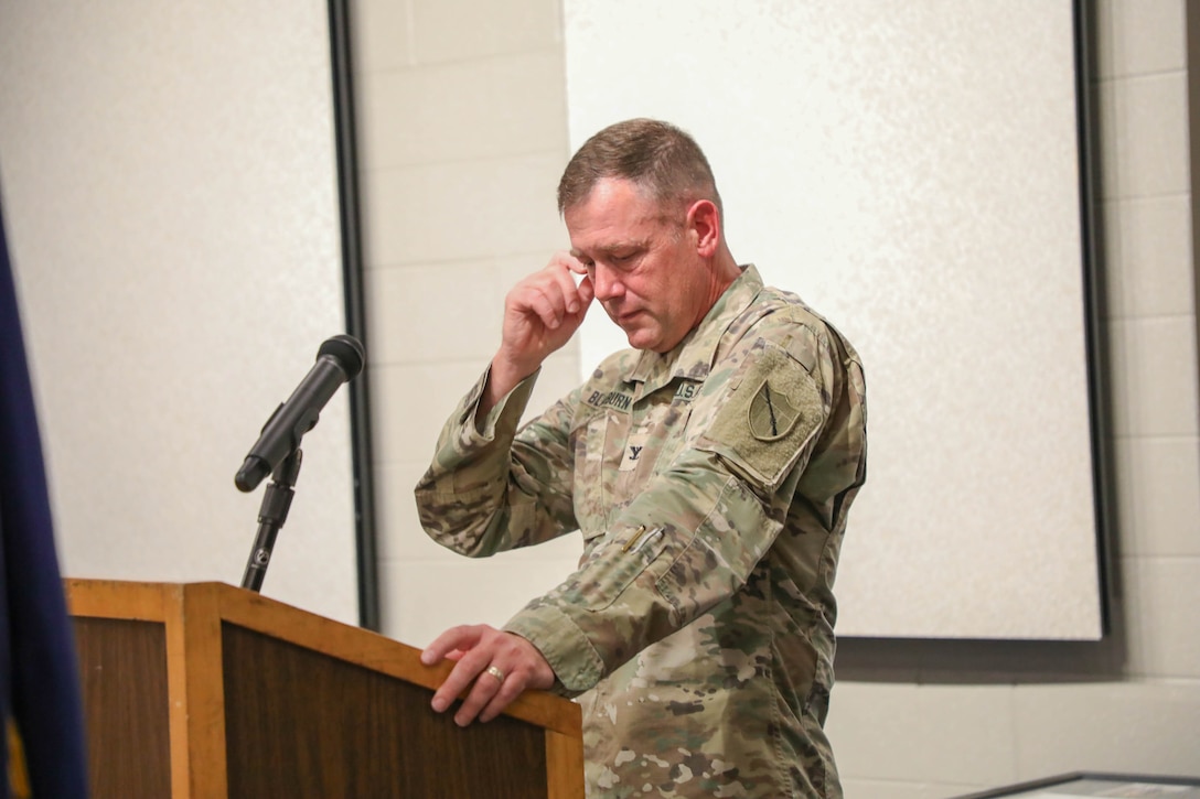 Army Col. John B. Blackburn speaks during his retirement