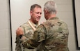 Maj. Gen. Haldane Lamberton, Adjutant General-Kentucky, awards Col. John B. Blackburn, the Silver Order of Mercury during his retirement ceremony