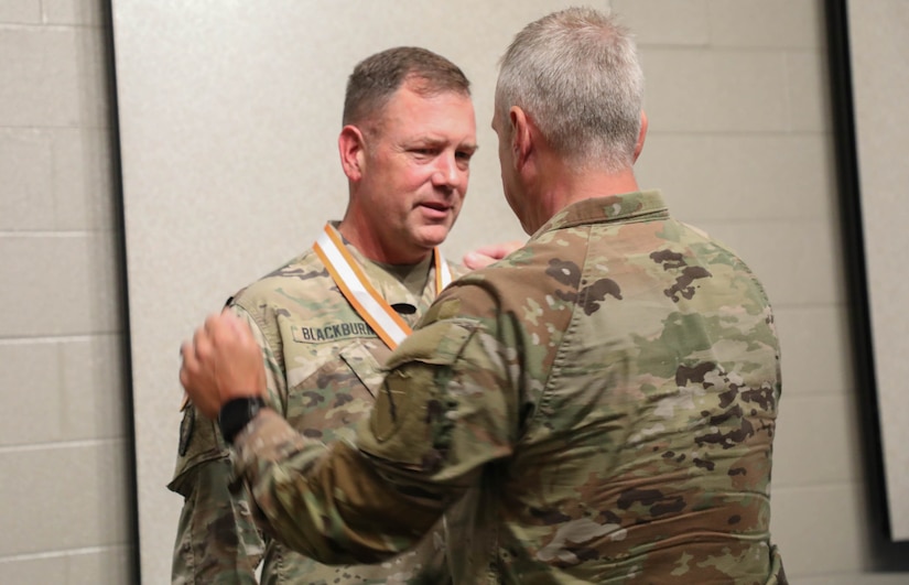 Maj. Gen. Haldane Lamberton, Adjutant General-Kentucky, awards Col. John B. Blackburn, the Silver Order of Mercury during his retirement ceremony