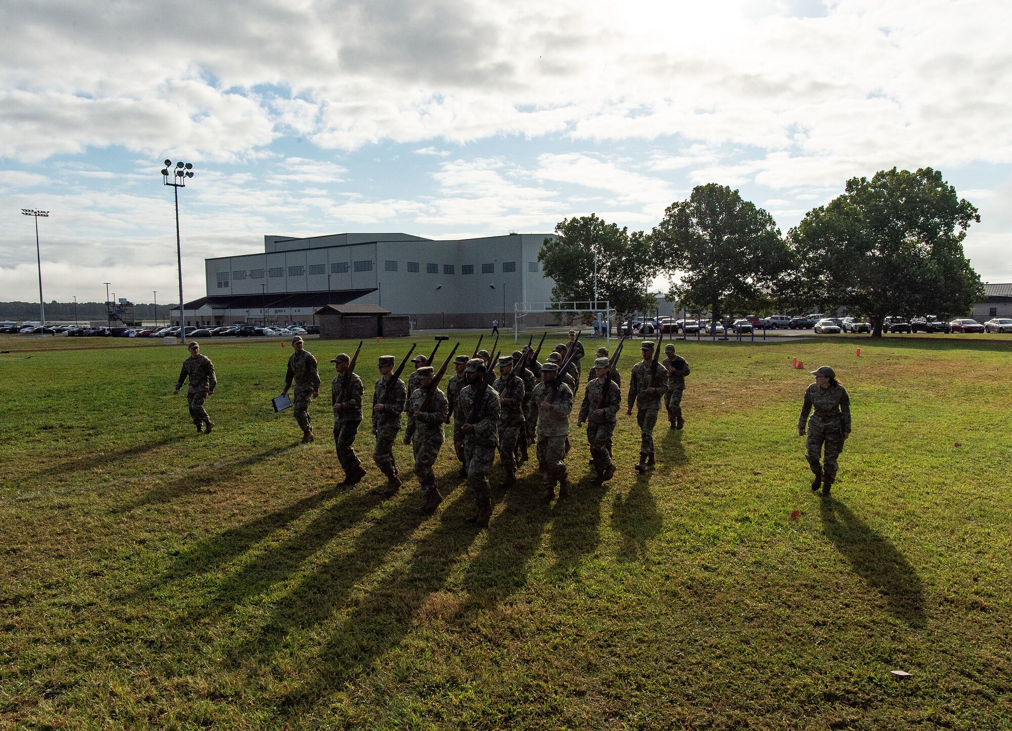 Dover Base Honor Guard cadre watch former BHG members practice marching in formation at the base track on Dover Air Force Base, Delaware, Sept. 6, 2024. Seventeen former BHG members went through a tryout process for ceremonial guardsman positions needed for the upcoming presidential inauguration ceremony scheduled in January 2025. (U.S. Air Force photo by Roland Balik)