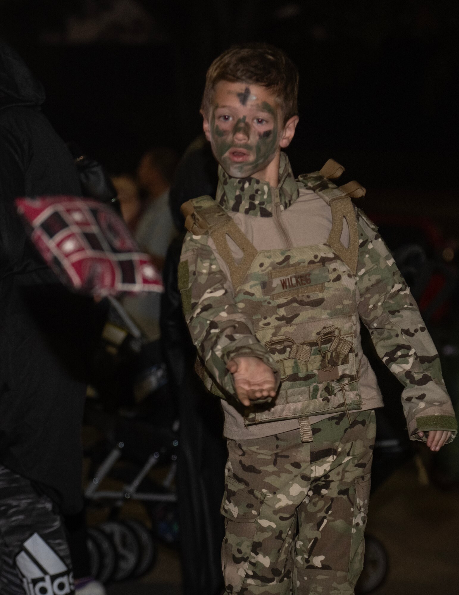 A child participates in a Cornhole game during the Halloween Spooktacular and Lead Wing Celebration at Seymour Johnson Air Force Base.