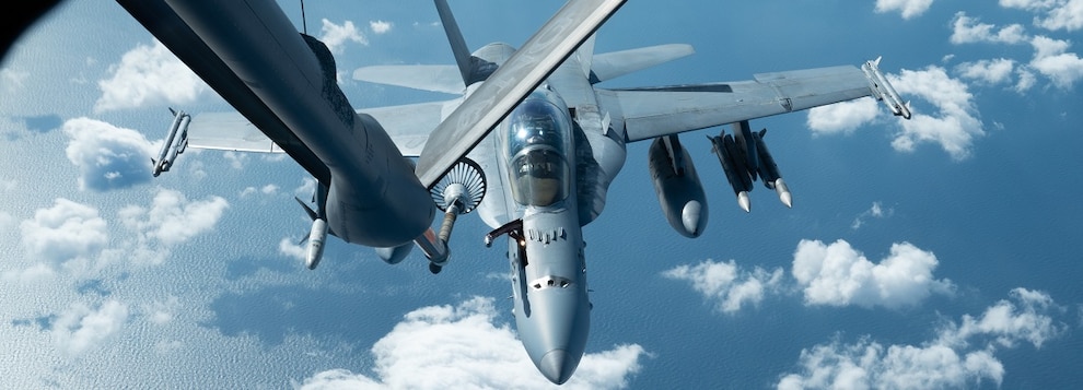 A U.S. Marine Corps F/A-18C Hornet assigned to Marine Fighter Attack Squadron 232, conducts aerial refeuling with a U.S. Air Force KC-135 Stratotanker assigned to the 909th Air Refueling Squadron, before a Keen Sword 25 training mission over the Sea of Japan, Oct. 31, 2024.