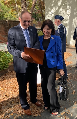 Retired Lt. Gen. David Deptula and spouse, Dianna, share a moment after the Holm Center alumni award induction ceremony