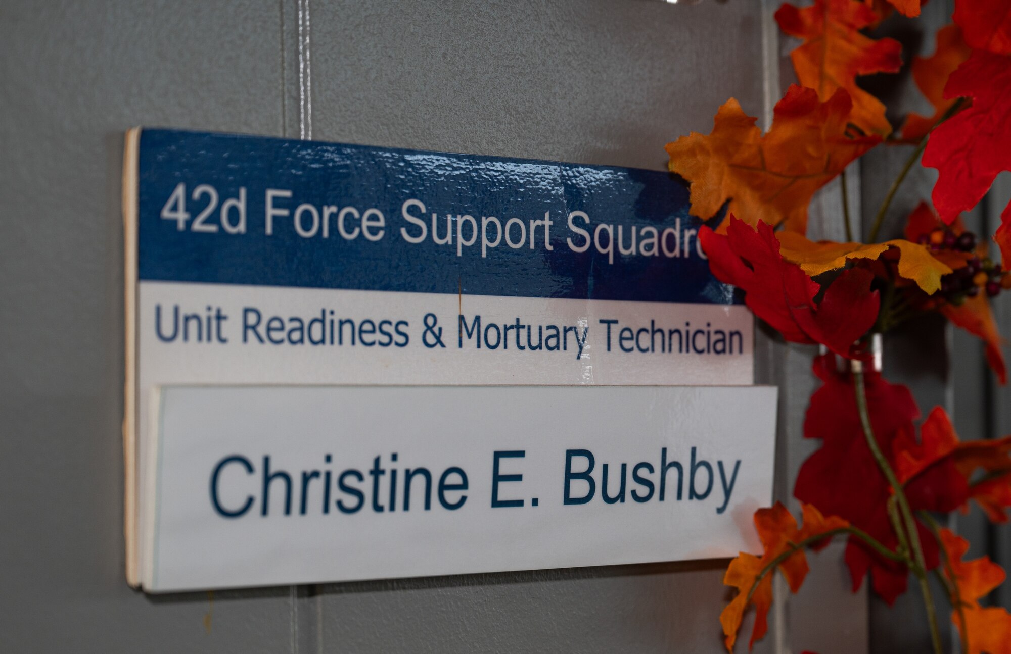A name plate next to the 42nd Force support Squadron mortuary affairs office entrance at Maxwell Air Force base, Alabama, Oct. 24, 2024. Mortuary affairs support fallen service members and their families, handing funeral operations, travel plans, and financial expenses while providing the utmost honor.