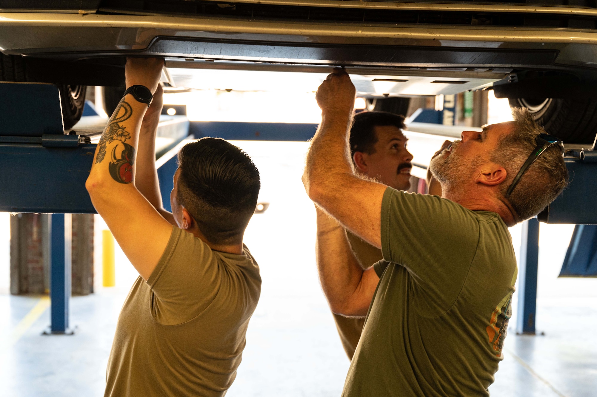 U.S. Airmen conduct car maintenance