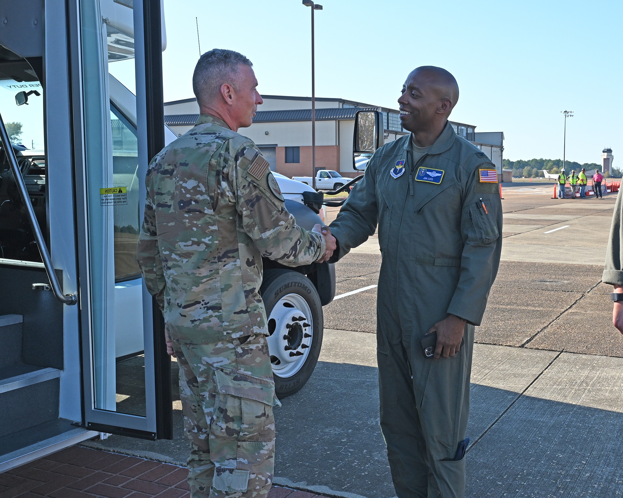 Maj. Gen. Kreuder shakes hands with Col. Jonathan Cato.