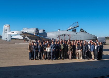 Members of the U.S. State Department’s International Visitor Leadership Program pose for a photo with Maryland Army National Guard Maj. Gen. Janeen L. Birckhead, 31st adjutant general of the Maryland National Guard and an A-10 aircraft.