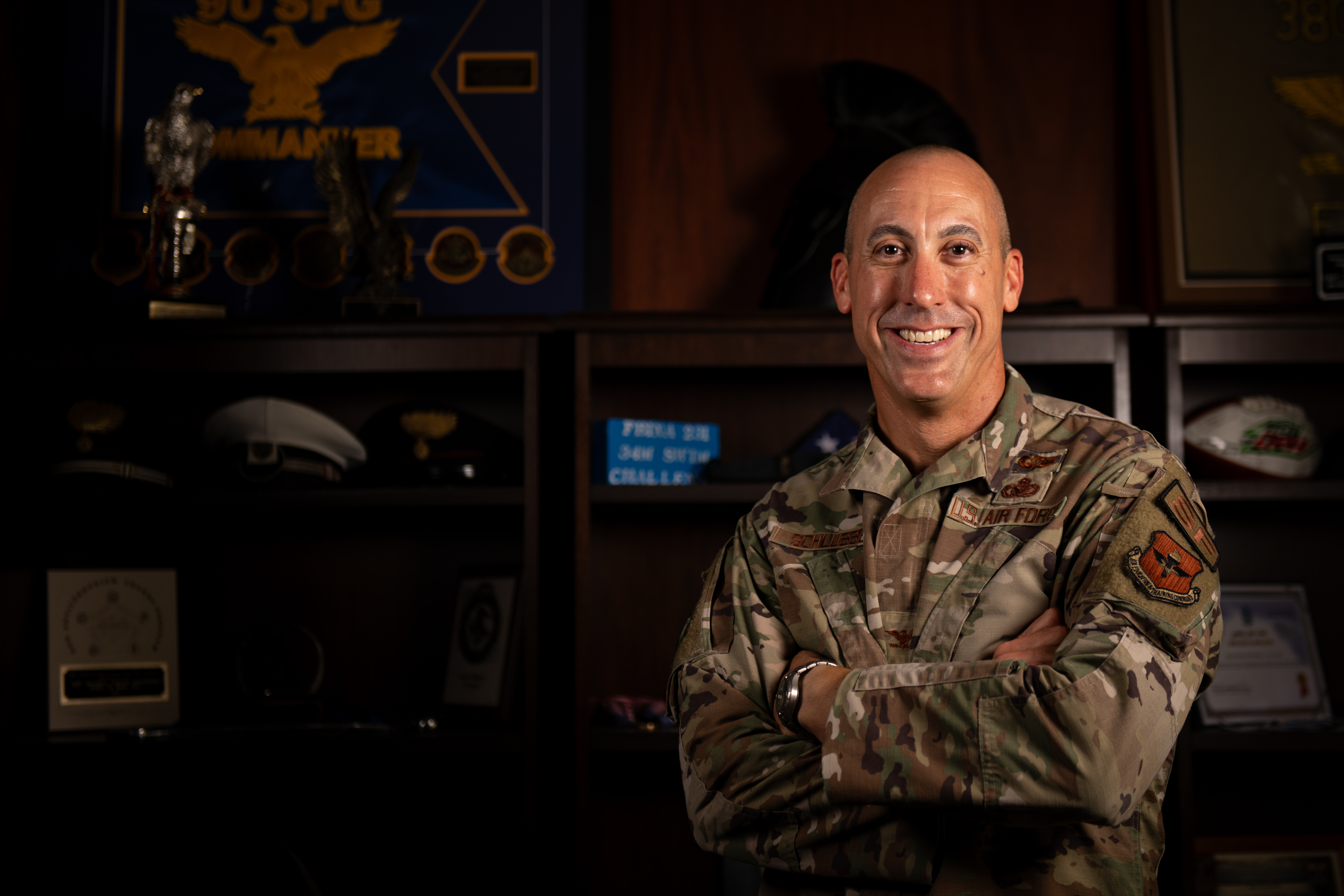 Col. Damian Schlussel, commander of the Thomas N. Barnes Center for Enlisted Education, poses for a photo in his office at Maxwell AFB-Gunter Annex, Ala., Sept. 24, 2024. The Barnes Center is named after the Air Force’s fourth Chief Master Sergeant of the Air Force, the first African American to attain the highest enlisted position in any branch of the U.S. Armed Forces. The Barnes Center is responsible for all stateside Noncommissioned Officer Academies, the Community College of the Air Force, the Senior NCO Academy, the Chief Leadership Course, the Air Force Enlisted Heritage Research Institute and the Enlisted Professional Military Education Instructor Course. It also provides content, curriculum and guidance for all Airman Leadership Schools, Foundations courses and overseas NCO Academies. (U.S. Air Force photo by Tech. Sgt. Janiqua P. Robinson)