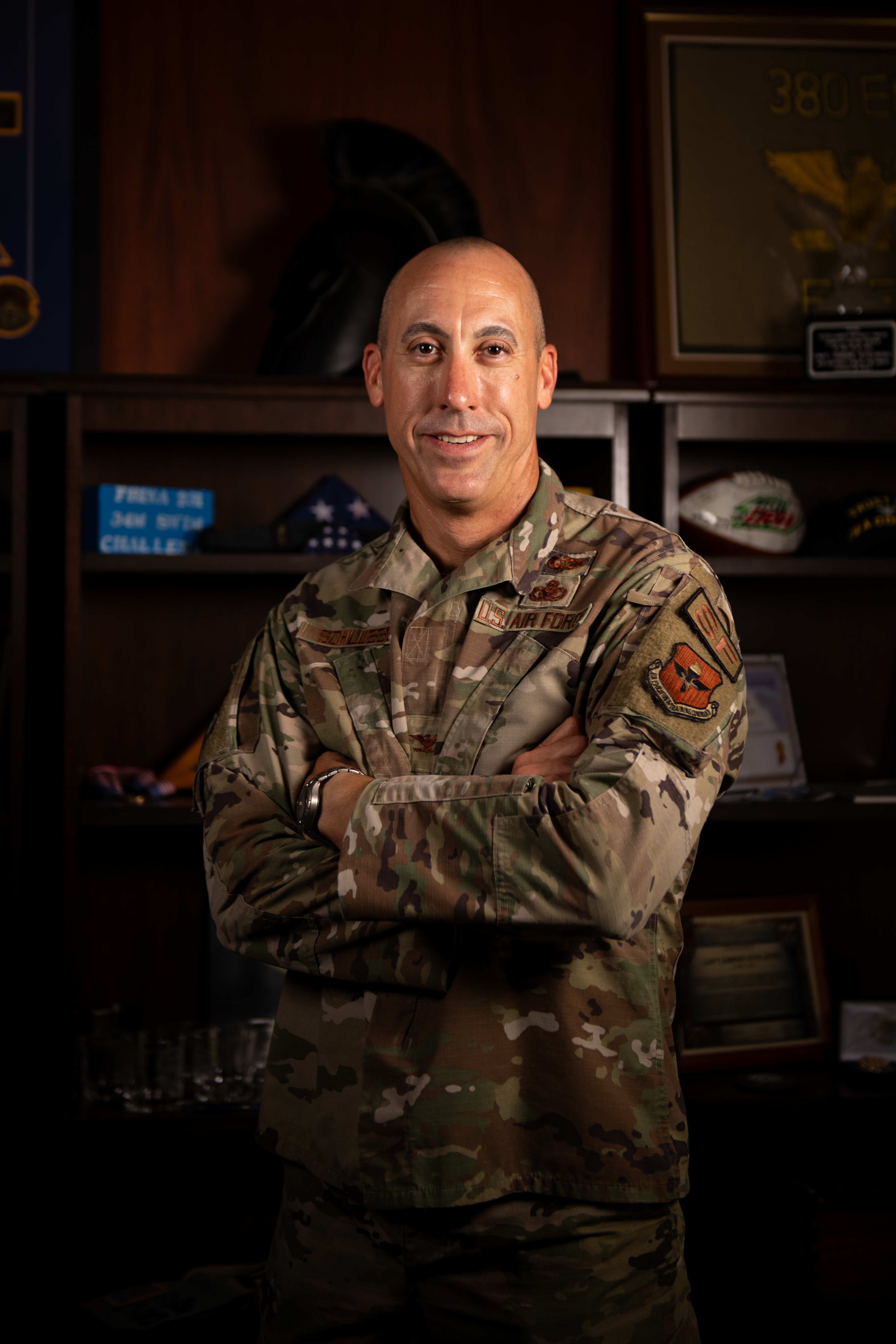 Col. Damian Schlussel, commander of the Thomas N. Barnes Center for Enlisted Education, poses for a photo in his office at Maxwell AFB-Gunter Annex, Ala., Sept. 24, 2024. The Barnes Center is named after the Air Force’s fourth Chief Master Sergeant of the Air Force, the first African American to attain the highest enlisted position in any branch of the U.S. Armed Forces. The Barnes Center is responsible for all stateside Noncommissioned Officer Academies, the Community College of the Air Force, the Senior NCO Academy, the Chief Leadership Course, the Air Force Enlisted Heritage Research Institute and the Enlisted Professional Military Education Instructor Course. It also provides content, curriculum and guidance for all Airman Leadership Schools, Foundations courses and overseas NCO Academies. (U.S. Air Force photo by Tech. Sgt. Janiqua P. Robinson)