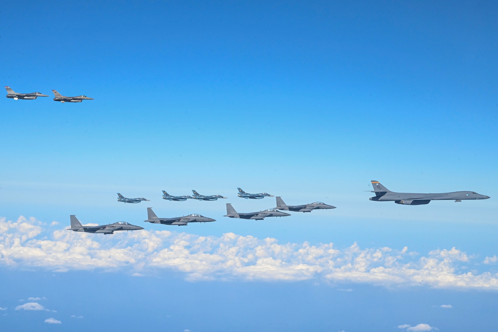 Fighter aircraft from the U.S., Japan, and the Republic of Korea conduct a trilateral escort flight of U.S. bombers operating in the Indo-Pacific, Nov. 3, 2024. Two U.S. F-16 from the 36th Fighter Squadron, 51st Fighter Wing flew with four Japan Air Self-Defense Force F-2s from the 8th Air Wing and four Republic of Korea Air Force F-15Ks from the 11th Fighter Wing to escort one U.S. Air Force B-1B Lancer. (U.S. Air Force photo by Senior Airman Maria Umanzor Guzman)