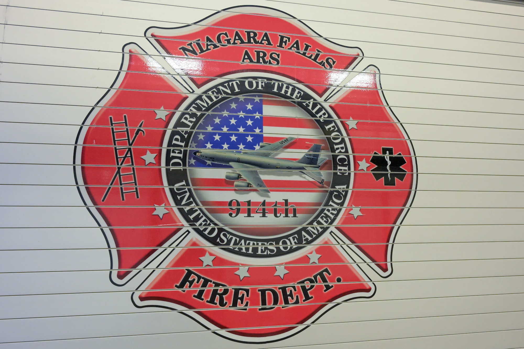 A fire truck assigned to the Niagara Falls Air Reserve Station Fire Department sits in the vehicle bay.