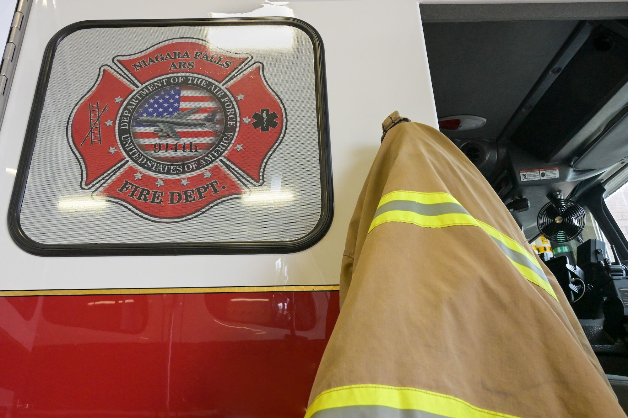 A fire truck assigned to the Niagara Falls Air Reserve Station Fire Department sits in the vehicle bay.