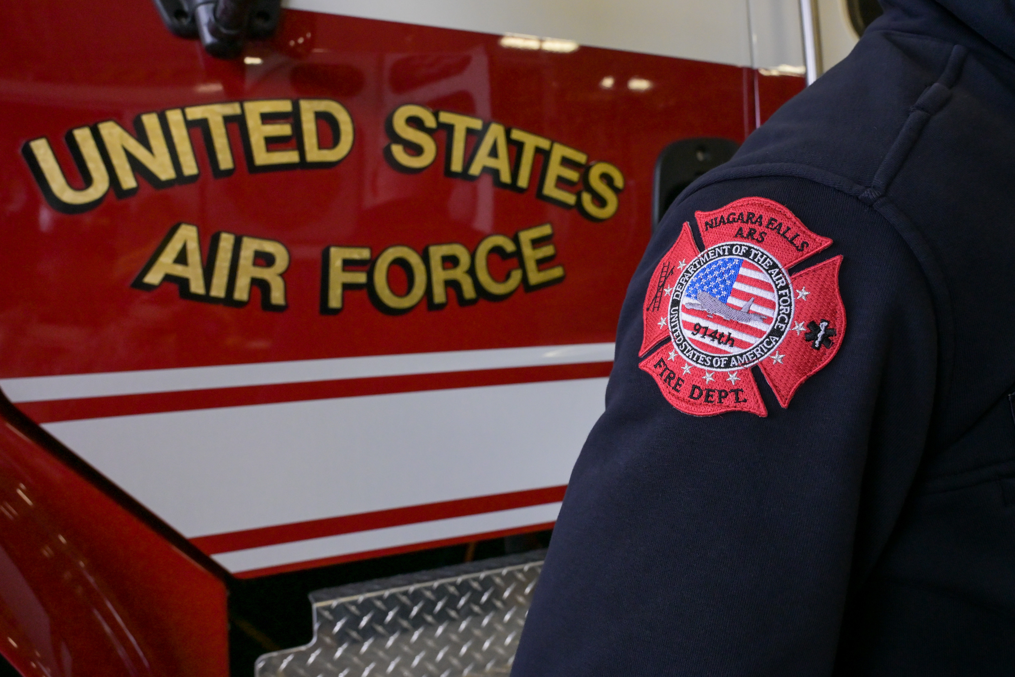 A fire truck assigned to the Niagara Falls Air Reserve Station Fire Department sits in the vehicle bay.