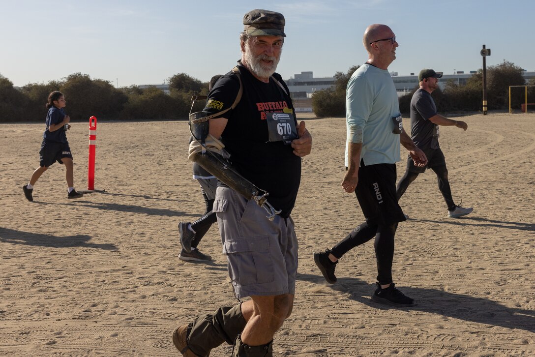 A contestant participates in the 2024 Marine Corps Recruit Depot Boot Camp Challenge, Oct. 19, 2024. For the past 23 years, MCRD San Diego has hosted the bootcamp Challenge, a three-mile obstacle course race guided by 60 drill instructors that highlights the physical and mental demands of bootcamp. The event fosters camaraderie and community engagement through interaction with MCRD personnel. (U.S. Marine Corps photo by Lance Cpl. Jacob B. Hutchinson)