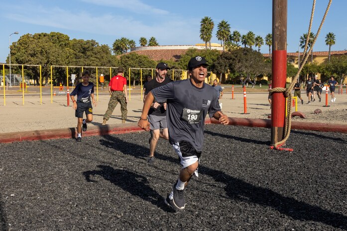 Contestants participate in the 2024 Marine Corps Recruit Depot Boot Camp Challenge, Oct. 19, 2024. For the past 23 years, MCRD San Diego has hosted the bootcamp Challenge, a three-mile obstacle course race guided by 60 drill instructors that highlights the physical and mental demands of bootcamp. The event fosters camaraderie and community engagement through interaction with MCRD personnel. (U.S. Marine Corps photo by Lance Cpl. Jacob B. Hutchinson)