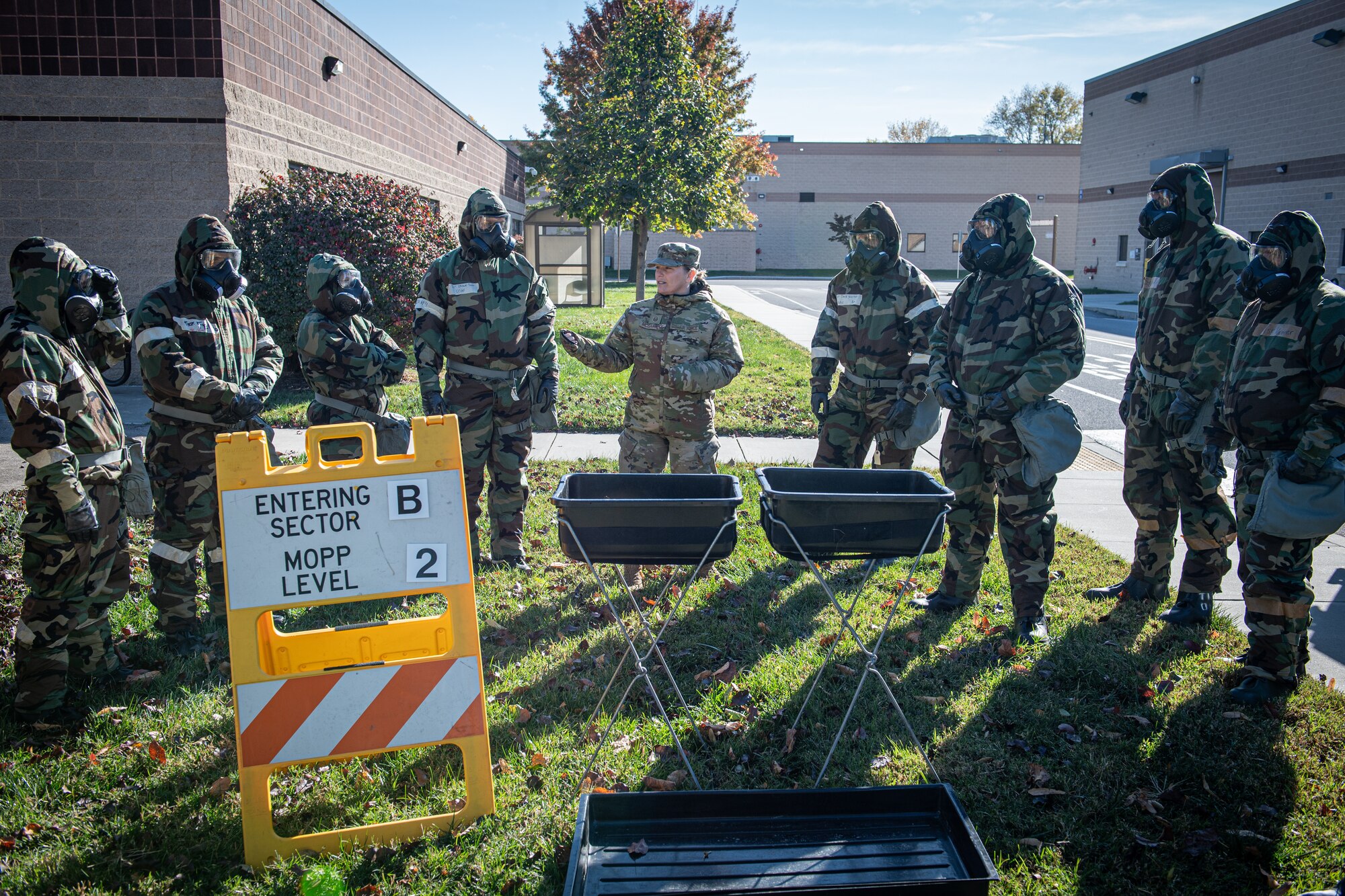 A 193rd Special Operations Wing Airman discusses decontamination procedures during chemical, biological, radiological, nuclear and explosive (CBRNE) training at Middletown, Pennsylvania, Nov. 3, 2024.