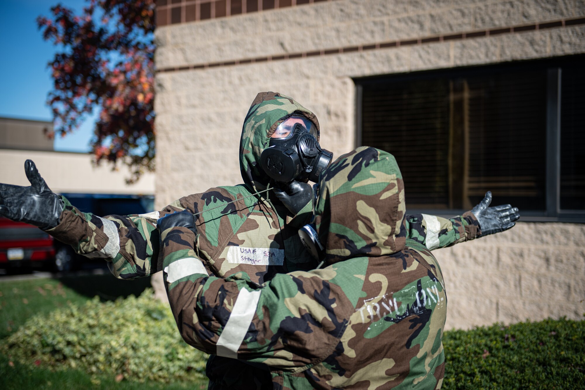 U.S. Airmen from the 193rd Special Operations Wing conduct buddy checks on their uniforms during chemical, biological, radiological, nuclear and explosive (CBRNE) training at Middletown, Pennsylvania, Nov. 3, 2024.