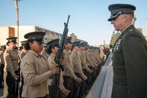 U.S. Marine Corps Lt. Col. Matthew Phelps, the commanding officer of 3rd Recruit Training Battalion, inspects Pfc. Isabella Martinez with India Company, 3rd Recruit Training Battalion during a battalion commander inspection at Marine Corps Recruit Depot San Diego, California, Oct. 23, 2024. The Battalion Commander’s Inspection surveys new Marines for knowledge, bearing, and attention to detail as one of their last tests before graduating. (U.S. Marine Corps photo by Cpl. Sarah M. Grawcock)