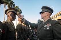 U.S. Marine Corps Lt. Col. Matthew Phelps, the commanding officer of 3rd Recruit Training Battalion, inspects Pfc. Arion Mckinley with India Company, 3rd Recruit Training Battalion during a battalion commander inspection at Marine Corps Recruit Depot San Diego, California, Oct. 23, 2024. The Battalion Commander’s Inspection surveys new Marines for knowledge, bearing, and attention to detail as one of their last tests before graduating. (U.S. Marine Corps photo by Cpl. Sarah M. Grawcock)