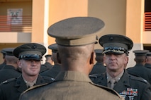U.S. Marine Corps Lt. Col. Matthew Phelps, the commanding officer of 3rd Recruit Training Battalion, right, and Capt. Thomas Mccarthy, the Company Commander, left, inspect Pfc. Arion Mckinley with India Company, 3rd Recruit Training Battalion during a battalion commander inspection at Marine Corps Recruit Depot San Diego, California, Oct. 23, 2024. The Battalion Commander’s Inspection surveys new Marines for knowledge, bearing, and attention to detail as one of their last tests before graduating. (U.S. Marine Corps photo by Cpl. Sarah M. Grawcock)