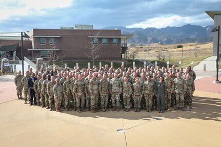 Gen. Gregory Guillot, Commander, North American Aerospace Defense Command and U.S. Northern Command, and Air Force Gen. Steven Nordhaus, Chief, National Guard Bureau, stand for a photo with National Guard Adjutants General conference attendees at the Colorado National Guard’s 168th Regional Training Site, Fort Carson, Colorado, Oct. 29, 2024.