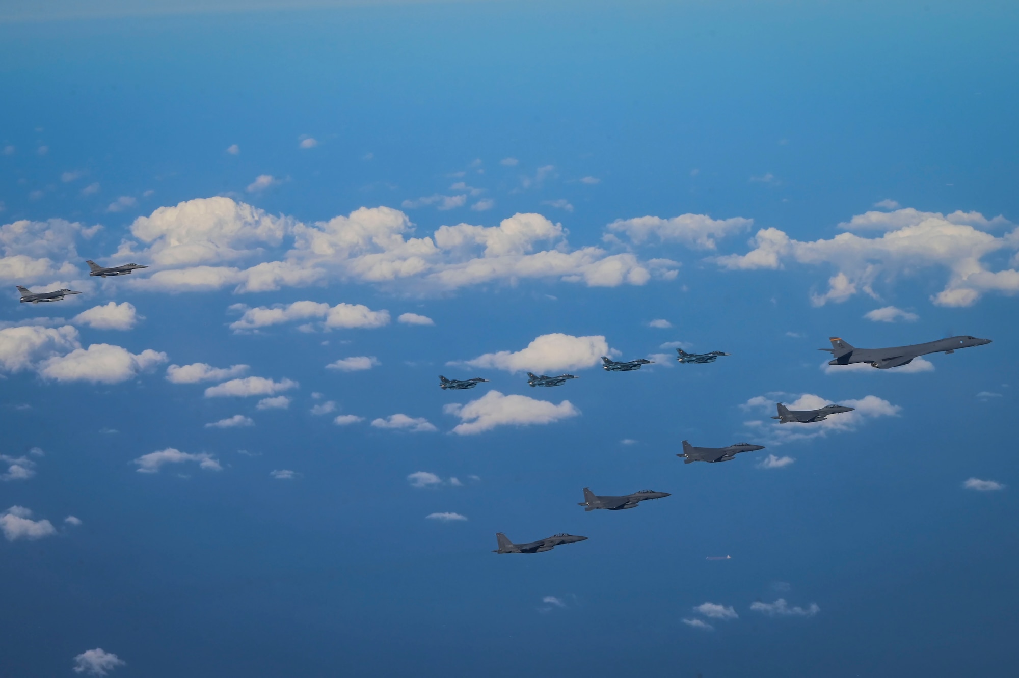Fighter aircraft from the U.S., Japan, and the Republic of Korea conduct a trilateral escort flight of U.S. bombers operating in the Indo-Pacific, Nov. 3, 2024. Two U.S. F-16 from the 36th Fighter Squadron, 51st Fighter Wing flew with four Japan Air Self-Defense Force F-2s from the 8th Air Wing and four Republic of Korea Air Force F-15Ks from the 11th Fighter Wing to escort one U.S. Air Force B-1B Lancer. (U.S. Air Force photo by Senior Airman Maria Umanzor Guzman)