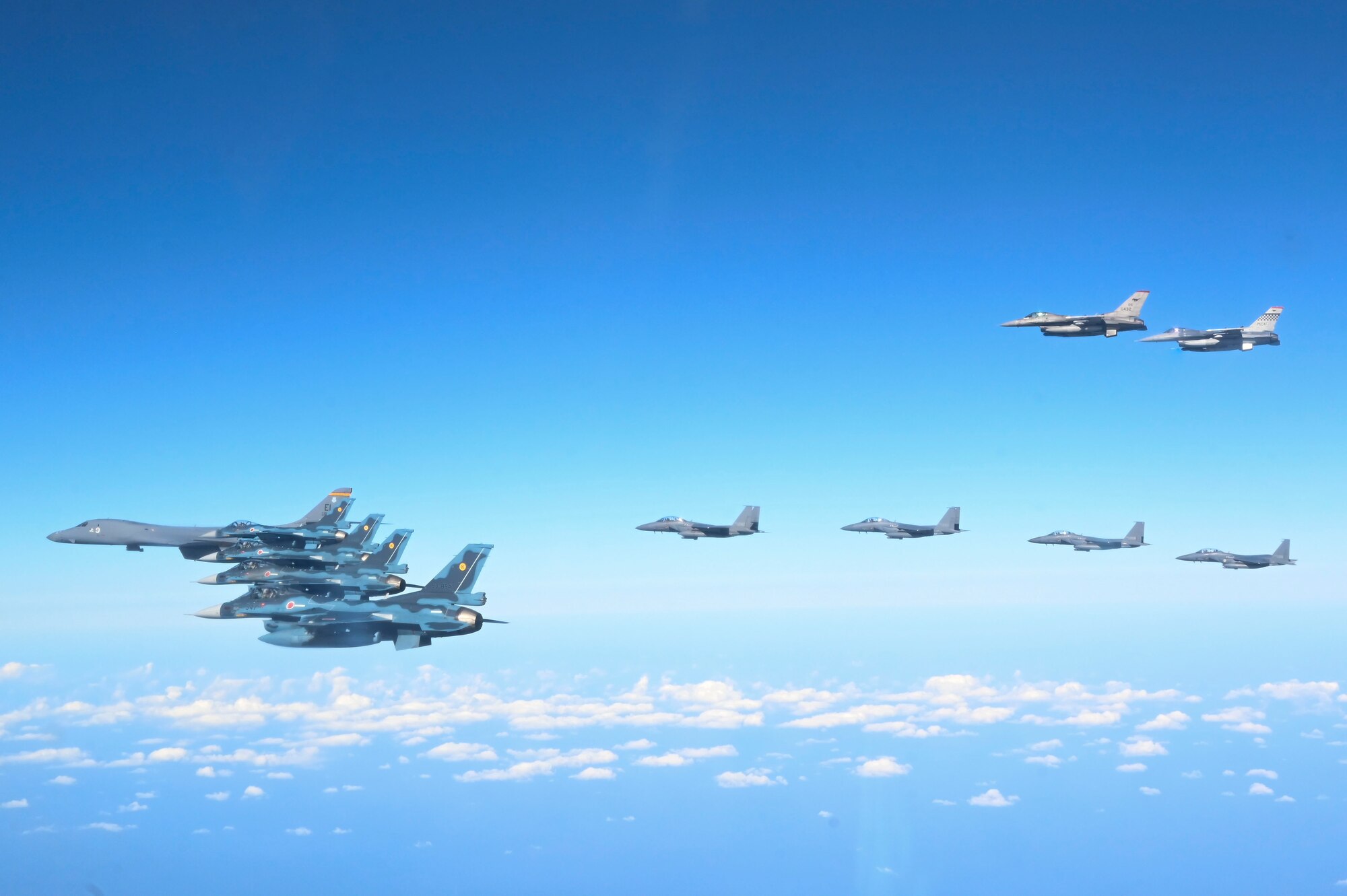 Fighter aircraft from the U.S., Japan, and the Republic of Korea conduct a trilateral escort flight of U.S. bombers operating in the Indo-Pacific, Nov. 3, 2024. Two U.S. F-16 from the 36th Fighter Squadron, 51st Fighter Wing flew with four Japan Air Self-Defense Force F-2s from the 8th Air Wing and four Republic of Korea Air Force F-15Ks from the 11th Fighter Wing to escort one U.S. Air Force B-1B Lancer. (U.S. Air Force photo by Senior Airman Maria Umanzor Guzman)